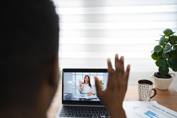 istock Black man talking in a business video call over laptop 2164958015