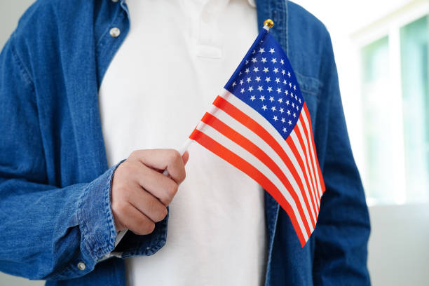 istock Learning English, Asian teenage student holding flag for language program education. 2164959281