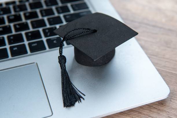 istock A graduation cap and a laptop. 2164960569