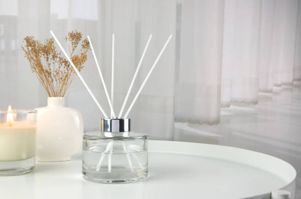 luxury aroma reed diffuser air freshener on table in nice modern livingroom luxury aroma essential oil reed diffuser air freshener bottles on nice table in the modern design living room for relax ambient in the evening on Valentine day home diffuser stock pictures, royalty-free photos & images