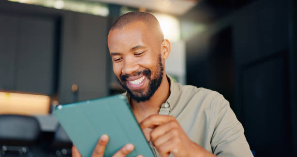 istock Black man, tablet and reading online smile, internet and digital conversation for planning. Thinking, touchscreen and entrepreneur for good news email, male person and startup technology business 2164969160