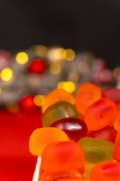Christmas Gummy Colorful Candy on Garland Background