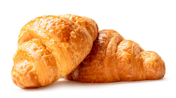 istock Side view of brown croissants in stack isolated on white background with clipping path 2164971590