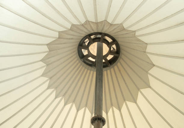 istock Upward view of large tent with main steel support pole. 2164976400
