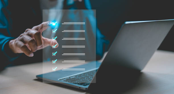 istock Businessman using laptop doing online checklist survey, Business performance checklist, filling out digital form checklist, 2164978951