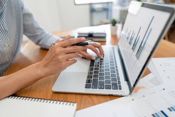 istock Hand holding pen pointing at laptop, online working corporate. 2164981338