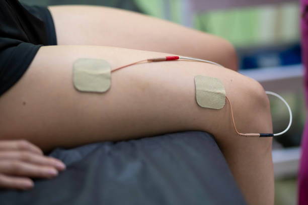 istock Physiotherapist doing electrotherapy on the leg 2164982511