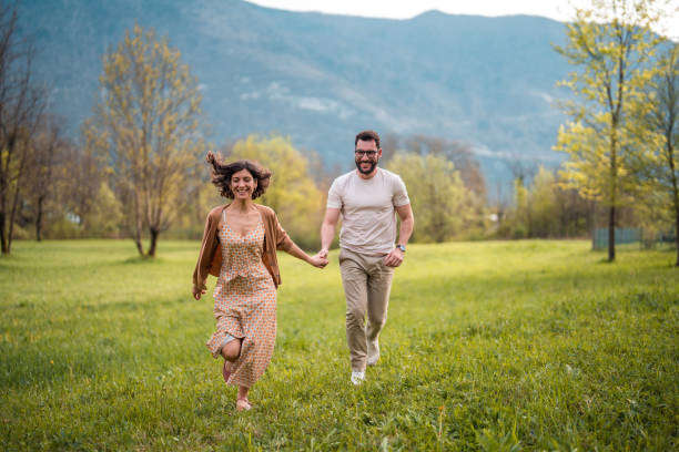 istock Interracial Couple Enjoying Garden Stroll 2164983297