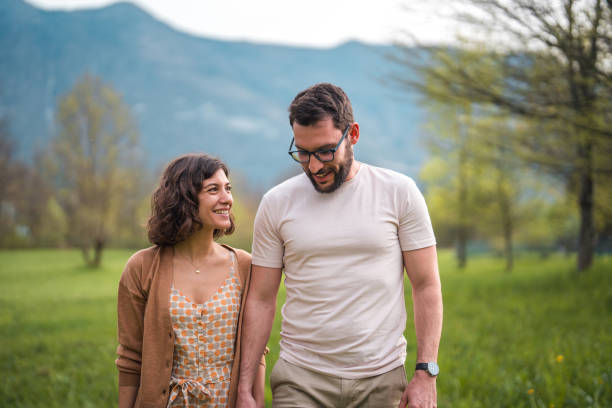istock Interracial Couple Enjoying Garden Stroll 2164983304