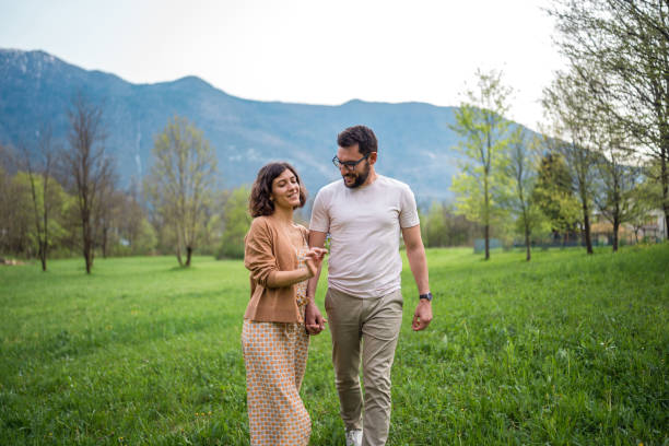istock Romantic Stroll in Garden Setting for Diverse Couple 2164983314