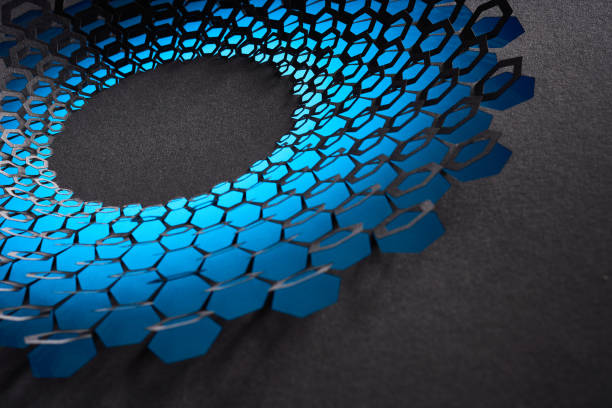 Native image size: 7952 x 5304. This striking image showcases an intricate cut paper artwork featuring a circular pattern composed of hexagonal shapes. The hexagons display a gradient of blue shades, transitioning from lighter to darker tones, creating a captivating sense of depth and movement. Set against a dark background, the vibrant blue hues stand out prominently, highlighting the precision and artistry involved in the design. The interplay of light and shadow adds to the visual impact, making this piece a stunning example of contemporary paper art with a geometric focus.