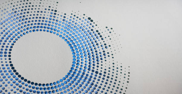istock Intricate circular cut paper artwork featuring a gradient of blue dots creating a mesmerizing visual effect 2164984996