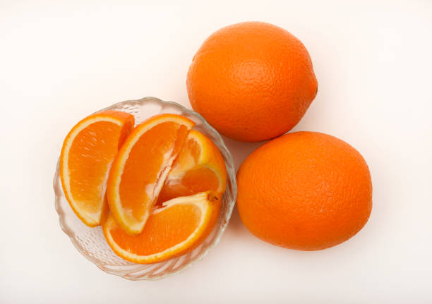 Sliced oranges on a white background. Chopped fruits.