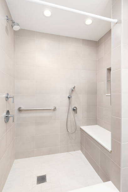 istock A walk-in shower with brown tiles. 2164989667
