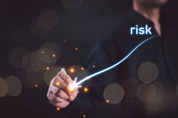 istock Low level risk business control concept. Businessman use pen to analyze risk opportunities, and plan risk level indicators. Lower rating to high digital virtual measure. Risk management for financial 2164990096