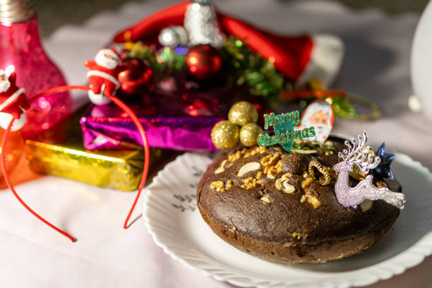 Christmas eve celebration with cake and decorative items at home at night from different angle