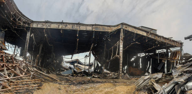 istock Burnt warehouse with a metal frame and sandwich panels. 2164994945