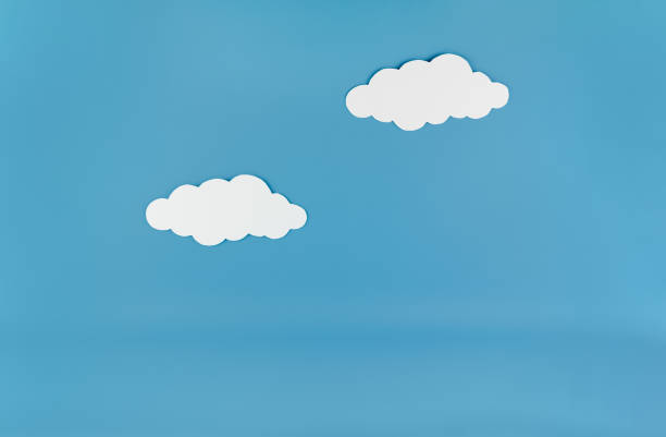 istock White clouds paper cutout on blue background template mock up with copy space 2164995648