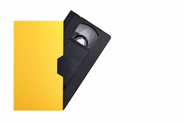 retro VHS video cassette in golden box, top view, close-up, isolated on white