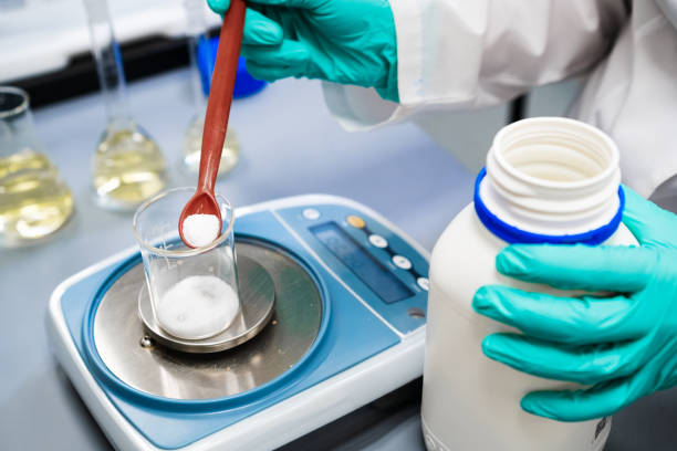 istock Powder samples being weighed by a woman using laboratory balances. 2164998468
