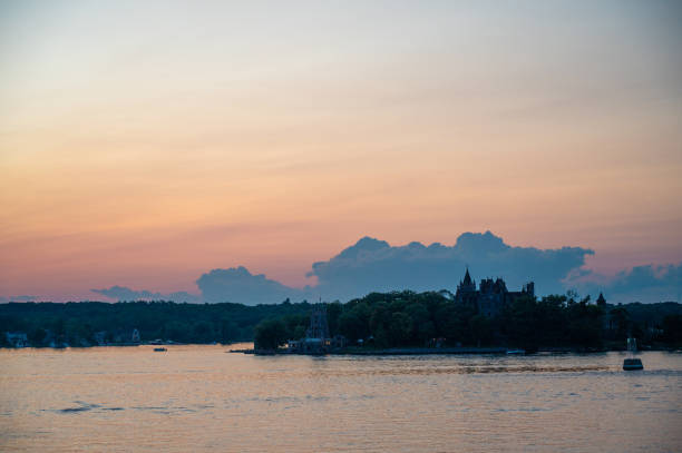 Boldt Castle over the Thousand Islands in Alexandria Bay, seen from the St. Lawrence river, during summer sunset