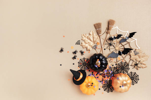 istock Halloween party decorations frame from pumpkins, bats, spider web top view. Happy halloween holiday greeting card. 2165003190
