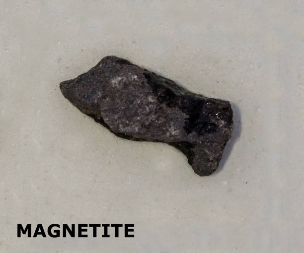istock Isolated sample of a Magnetite rock on texture background. Magnetite Igneous Rock sample. Magnetite stone isolated. 2165006411