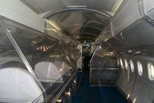 istock Empty cabin of a passenger plane from the inside with rows of seats in perspective 2165012041
