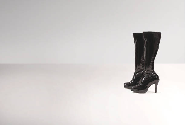 istock Sexy black thigh high leather boots on a white background 2165015823