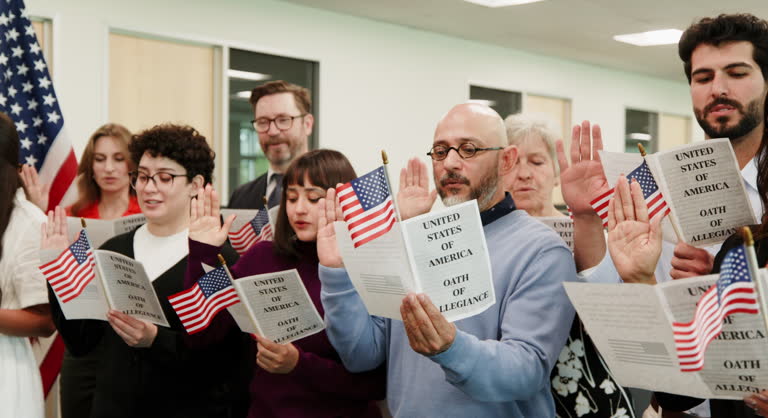 Group of People Taking the USA Naturalization Oath of Allegiance