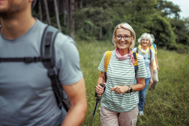 istock Senior hikers enjoying their day at forest 2165018201