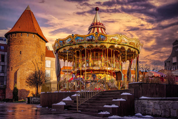 istock Shiny festive carousel with toy horses 2165019727