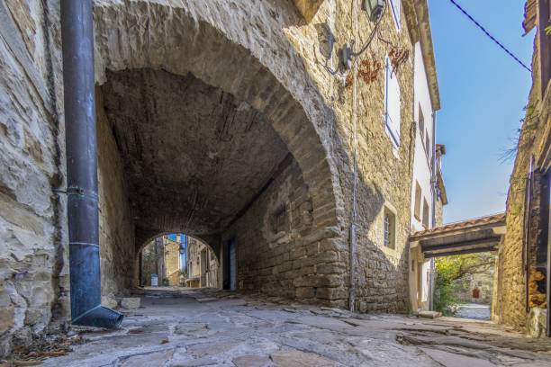 istock old, old alleyway with a blue sky in the background 2165022708