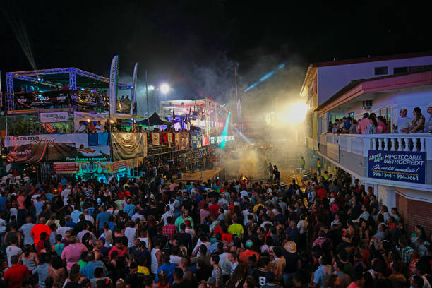 A dark concert venue illuminated by a sea of phone flashlights, creating a breathtaking starry sky effect. The silhouettes of the crowd add depth, emphasizing the immersive live music experience. A powerful symbol of unity, emotion, and connection at live events.