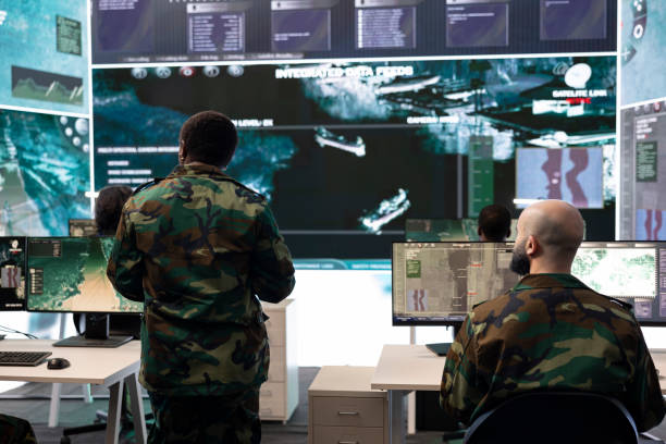 istock Woman general supervising special operation with big data in control room 2165022978