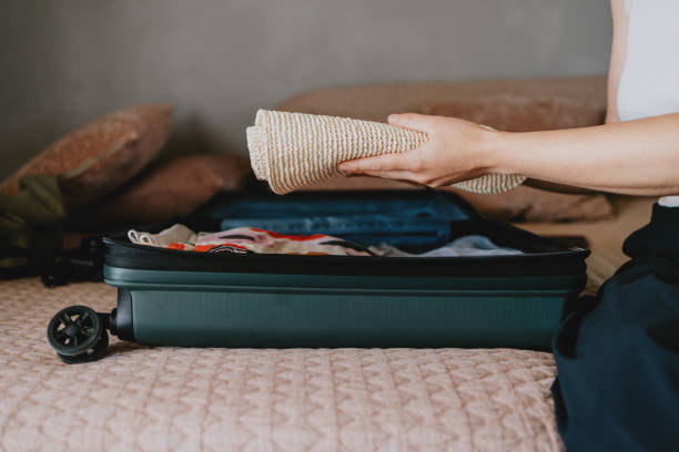 istock Woman Packing a Suitcase for a Trip with Neatly Folded Items 2165024788