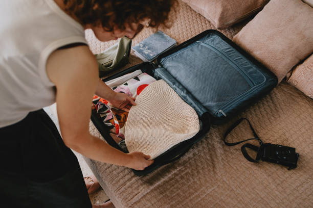 istock Woman Packing Essentials for a Summer Vacation Trip 2165024805