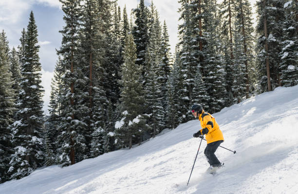 istock Graceful Skier Descending Steep Run 2165025115