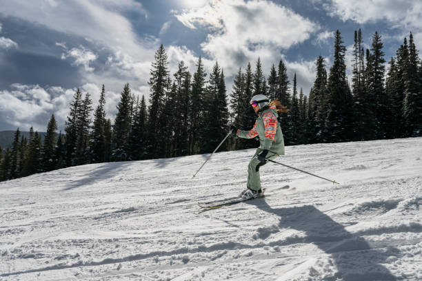 istock Profile View of Woman Skiing 2165025126