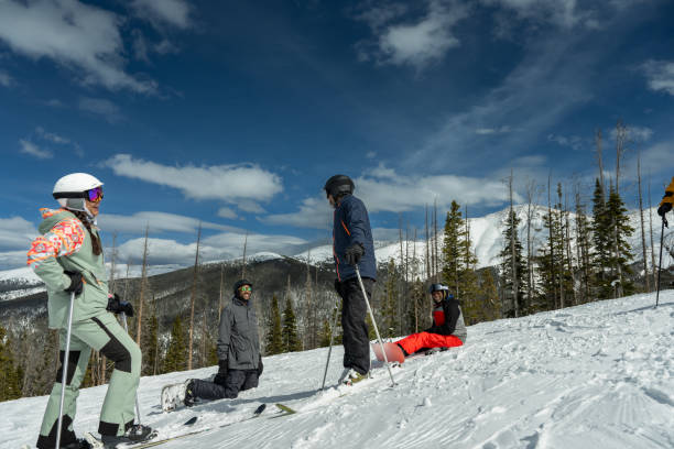 istock Black Skiers and Snowboarders Taking a Break 2165025221