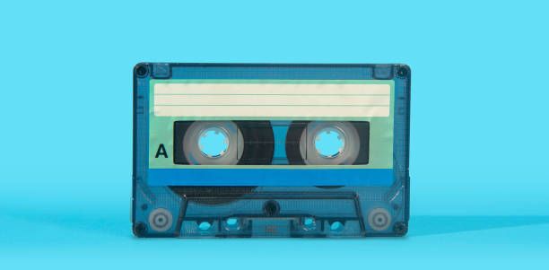 istock old transparent plastic music cassette on a blue surface against blue background 2165025338