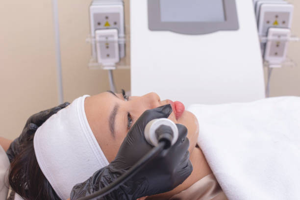 istock Using an RF electromagnetic device for radiofrequency skin tightening or contouring treatment. At a facial care, dermatologist or aesthetic clinic. 2165025737