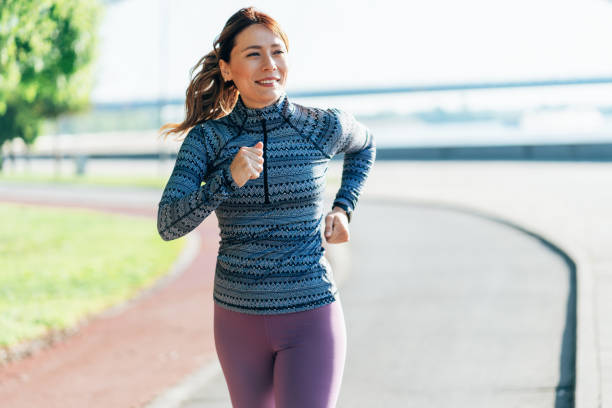 istock Happy sportswoman running 2165025880