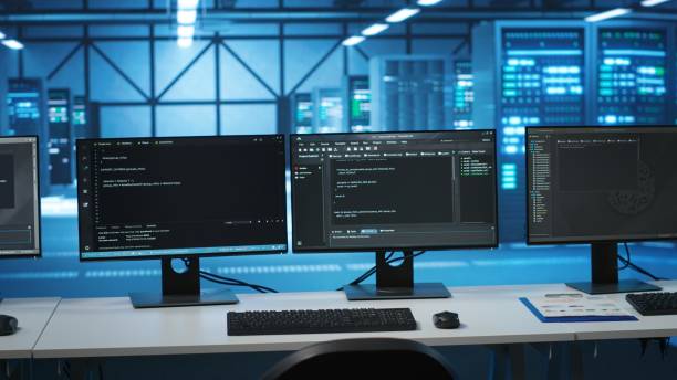 istock PC monitors on desk used for checking potential system failures in server room 2165026133
