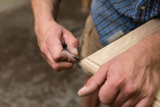 istock The carpenter manually sanded the corner of the oak panel with sandpaper 2165027358