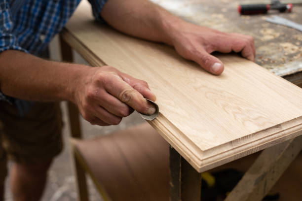 istock A carpenter grinds an oak panel with sandpaper 2165027361
