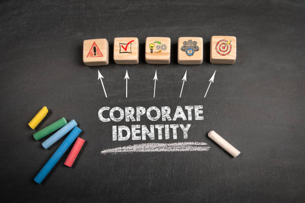 istock Corporate Identity. Wooden blocks on a dark chalkboard background 2165032772