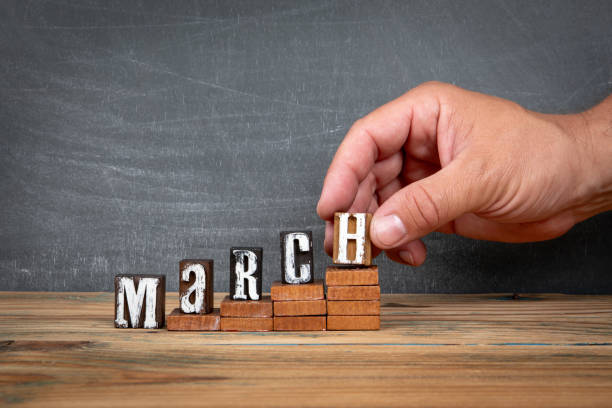 istock MARCH. Wooden letters, alphabet blocks on steps. development and growth concept 2165032799
