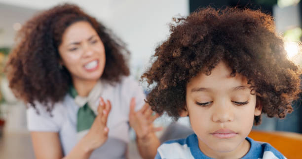 istock Discipline, angry and mom scolding child for behavior problem, naughty attitude and punishment on home sofa. Frustrated mama, stubborn kid and fight with lecture, learn manners and conflict drama 2165035516