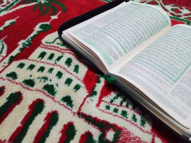 istock Al-Quran and prayer mat 2165038879